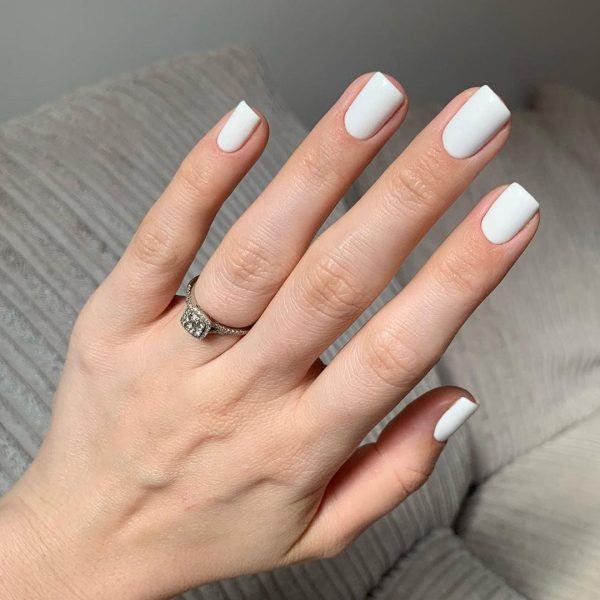 This is an image of a hand wearing Gemini Nail Colour No1 French White over the full nail plate showing an opaque white finish.
